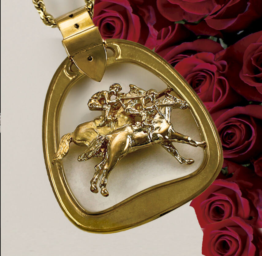 Solid gold horse racing stirrup pendant by Lesley Rand Bennett.