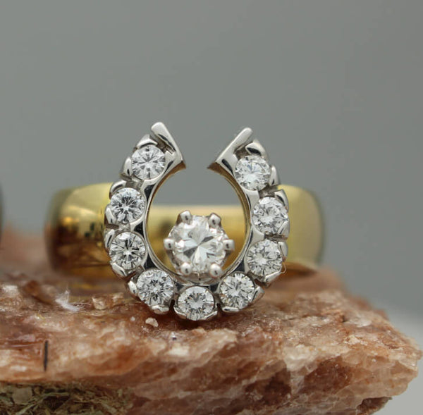 14k horseshoe ring with a total of 0.75ctw of diamonds by Lesley Rand Bennett