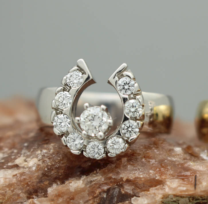 14k white gold horseshoe ring with a total of 0.75ctw of diamonds by Lesley Rand Bennett