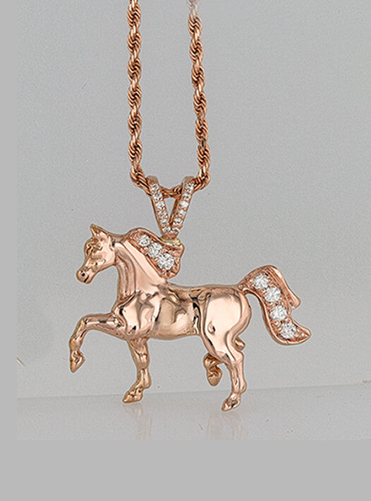 Rose gold trotting horse pendant with diamonds by Lesley Rand Bennett.