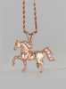 Rose gold trotting horse pendant with diamonds by Lesley Rand Bennett.