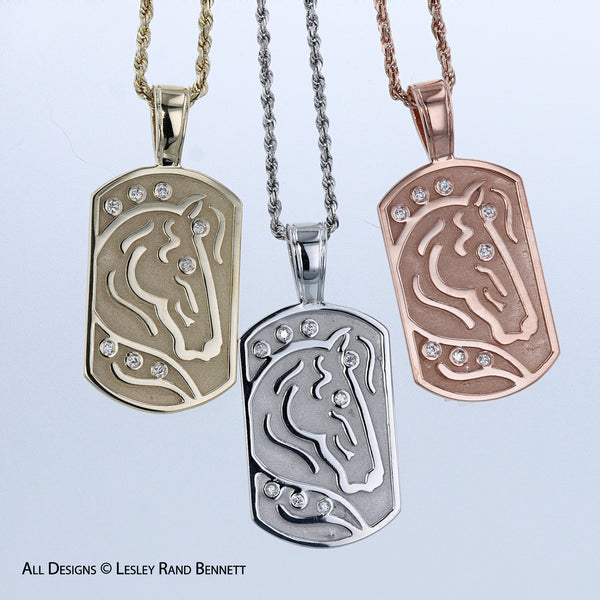 The International Horse Pendant by Lesley Rand Bennett. Pictured in 14k yellow, white and rose gold.