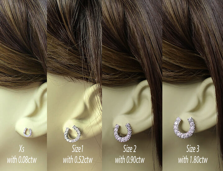 diamond horse shoe earrings. comparison of sizes on model