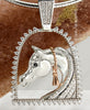 White gold and diamond horse and stirrup pendant by Lesley Rand Bennett.White gold Arabian Horse head with Rose gold tassel framed by a diamond stirrup and diamond bale.