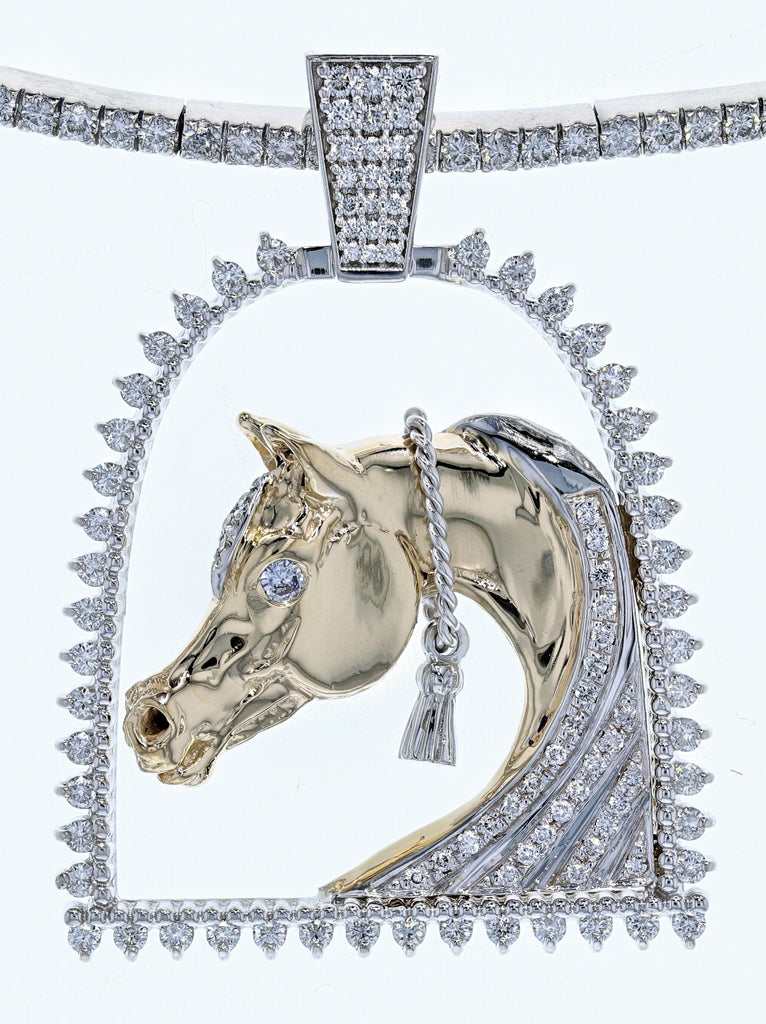 White gold and diamond horse and stirrup pendant by Lesley Rand Bennett. Yellow gold Arabian Horse head with white gold tassel framed by a diamond stirrup and diamond bale.