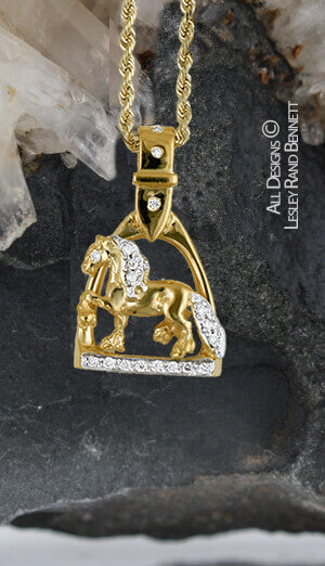 gold trotting friesian in stirrup pendant with diamonds . this copyright design is handcrafted by Lesley Rand Bennett 