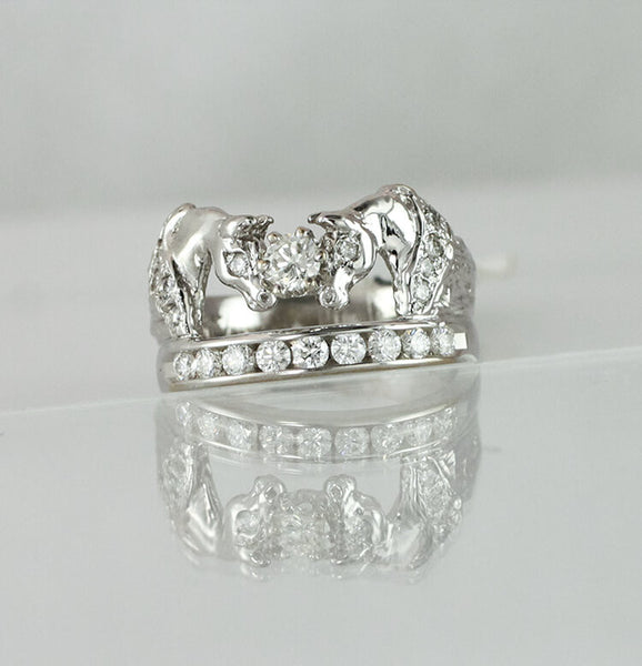 Two Horse Ring with diamond manes eyes and a row of diamonds beneath. 1/2 carat center stone total diamond weight is 1.10c.t.w. by Lesley Rand Bennett