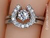 Two Become One diamond horseshoe wrap ring with 1/2 carat solitaire ring in 14k white gold by Lesley Rand Bennett.