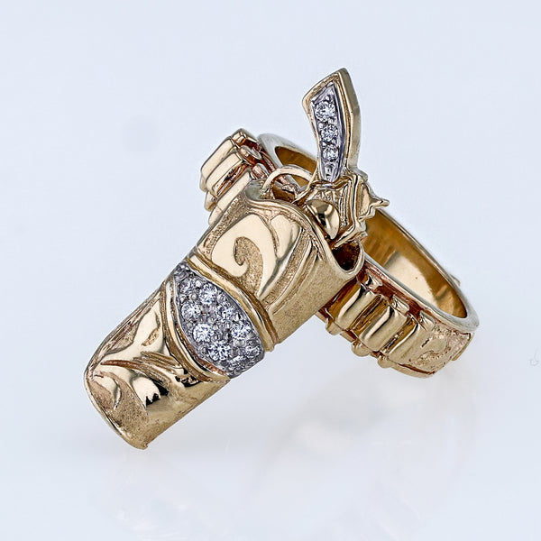 14k yellow gold sharp shooter pistol ring in gold holster with diamonds by Lesley Rand Bennett  Edit alt text