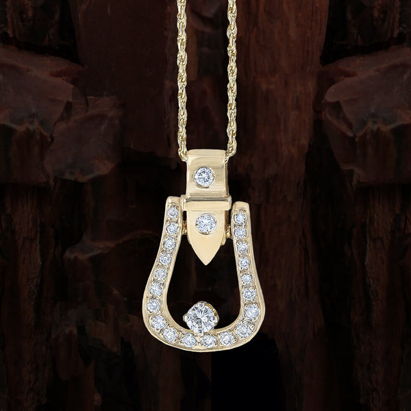 Diamond Western stirrup pendant in yellow gold by Lesley Rand Bennett